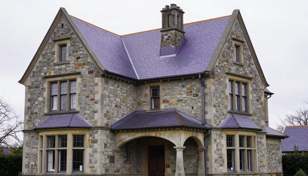 Natural slate roof on historic home showing multicolored stone tiles